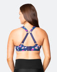 back view of active woman wearing a nursing sports bra in racerback