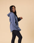 front view of active happy mother wearing hooded pregnancy & nursing sweatshirt in light blue