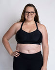 Breastfeeding mum wearing a plus cup size nursing bra in black