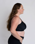 Side view of active mum wearing breastfeeding sports bra for a bigger bust