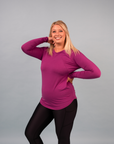 nursing mother showing the breastfeeding zips on magenta nursing long sleeve top