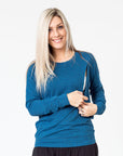 navy maternity top with long sleeves and invisible zip unzipped to breastfeed