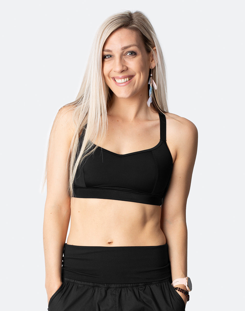 active mother wearing black racerback sports bra