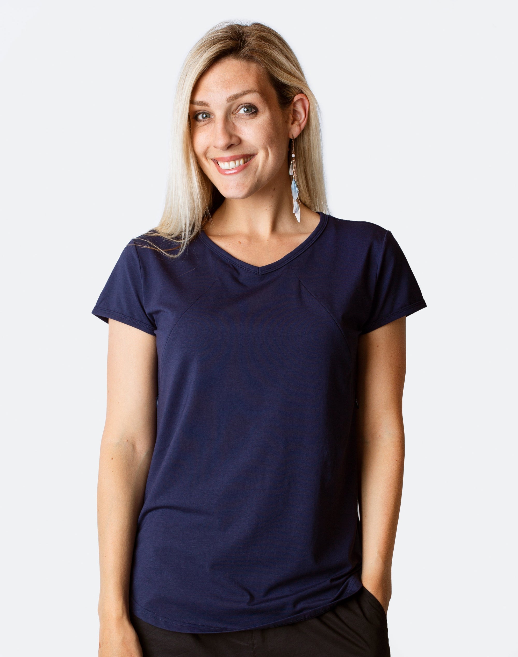 Happy, fit mum wearing tui blue breastfeeding scoop tee