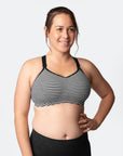 Breastfeeding mum in a striped nursing sports bra for high impact