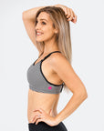 mum in a striped ultimate bra nursing sports bra side view showing Cadenshae logo