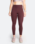 Front view of the high waisted maternity yoga pants in burgundy