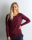 happy, fit mother wearing long sleeve bamboo top