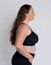 Side view of active mum wearing breastfeeding sports bra for a bigger bust