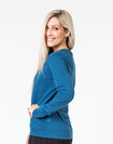 side view of a mum wearing a navy maternity top with long sleeves and invisible zips 
