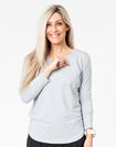 front view of a mum wearing a grey maternity top with long sleeves