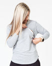 grey maternity top with long sleeves and invisible zip unzipped for breastfeeding