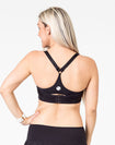 back view of a mom wearing a black maternity activewear bra with a racerback