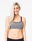fit mother wearing black and white striped maternity activewear bra