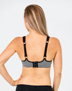 mum wearing a striped nursing sports bra view of back with option to wear as a normal bra