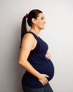 Happy, pregnant mother wearing maternity & breastfeeding tank