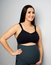 a mother wears a black wireless high impact sports bra in pregnancy
